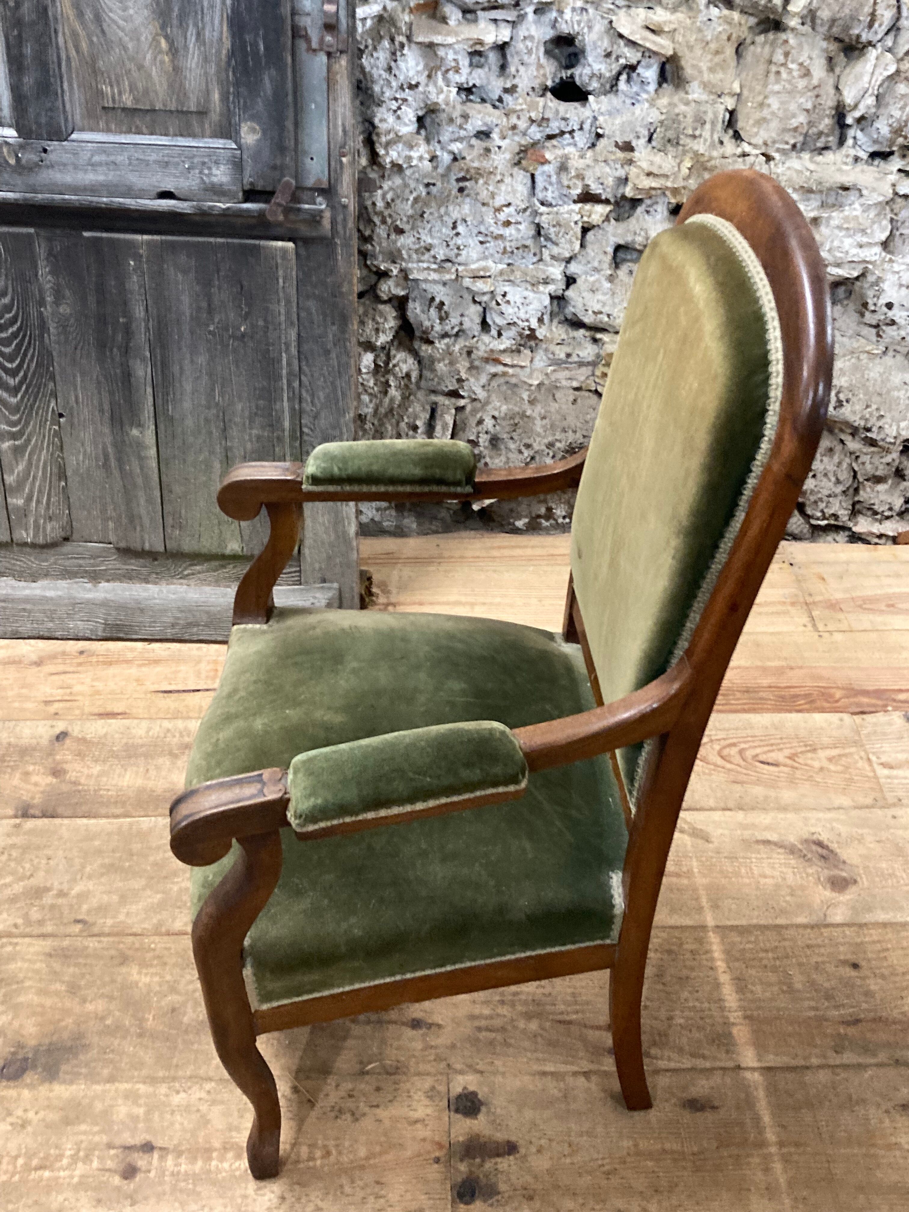Antique Voltaire armchair in wood and green velvet Louis Philippe