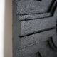 Wall sculpture, wood and black coating, late 1970s