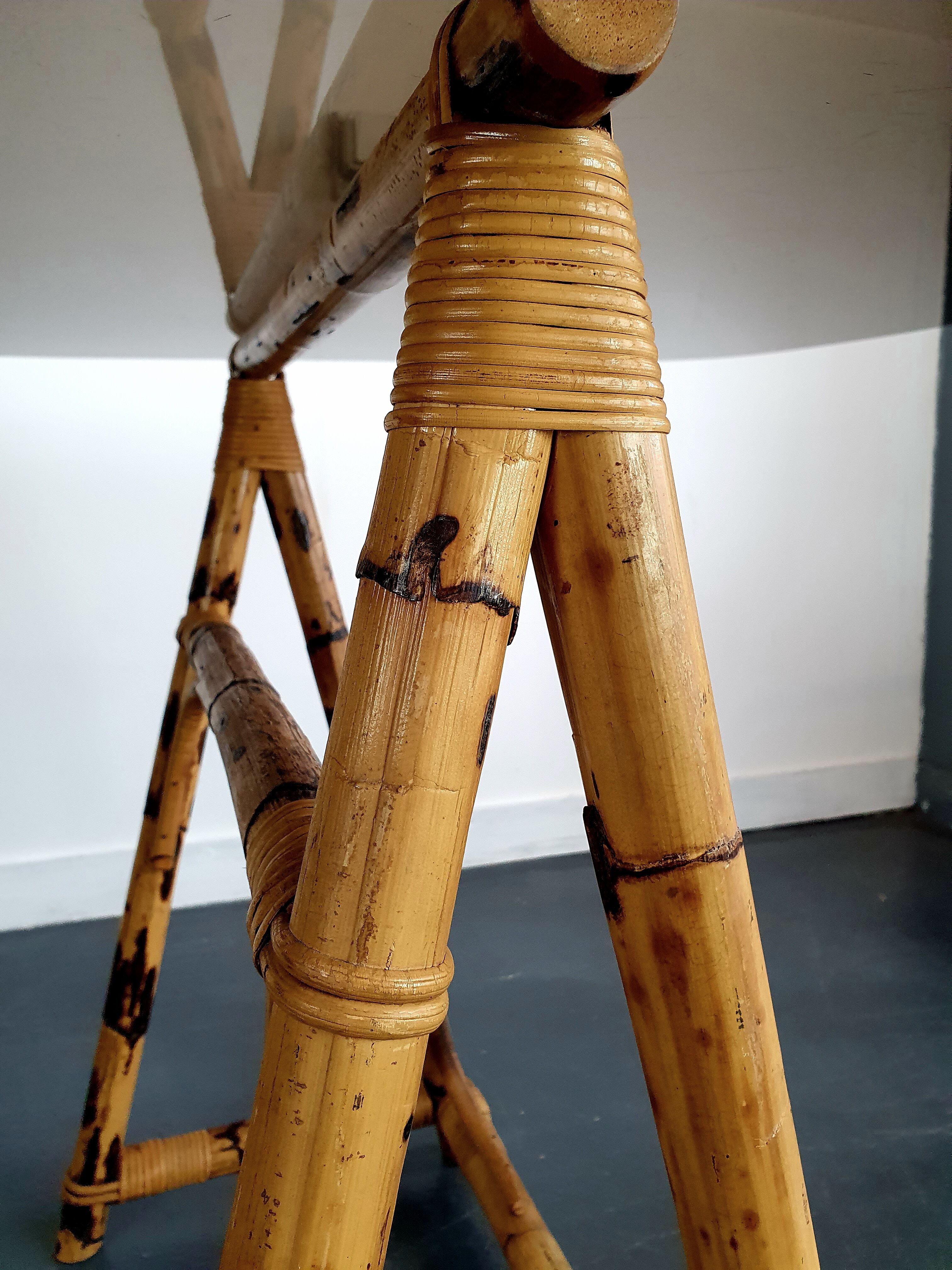 1970s dining table with bamboo trestle legs and smoked glass