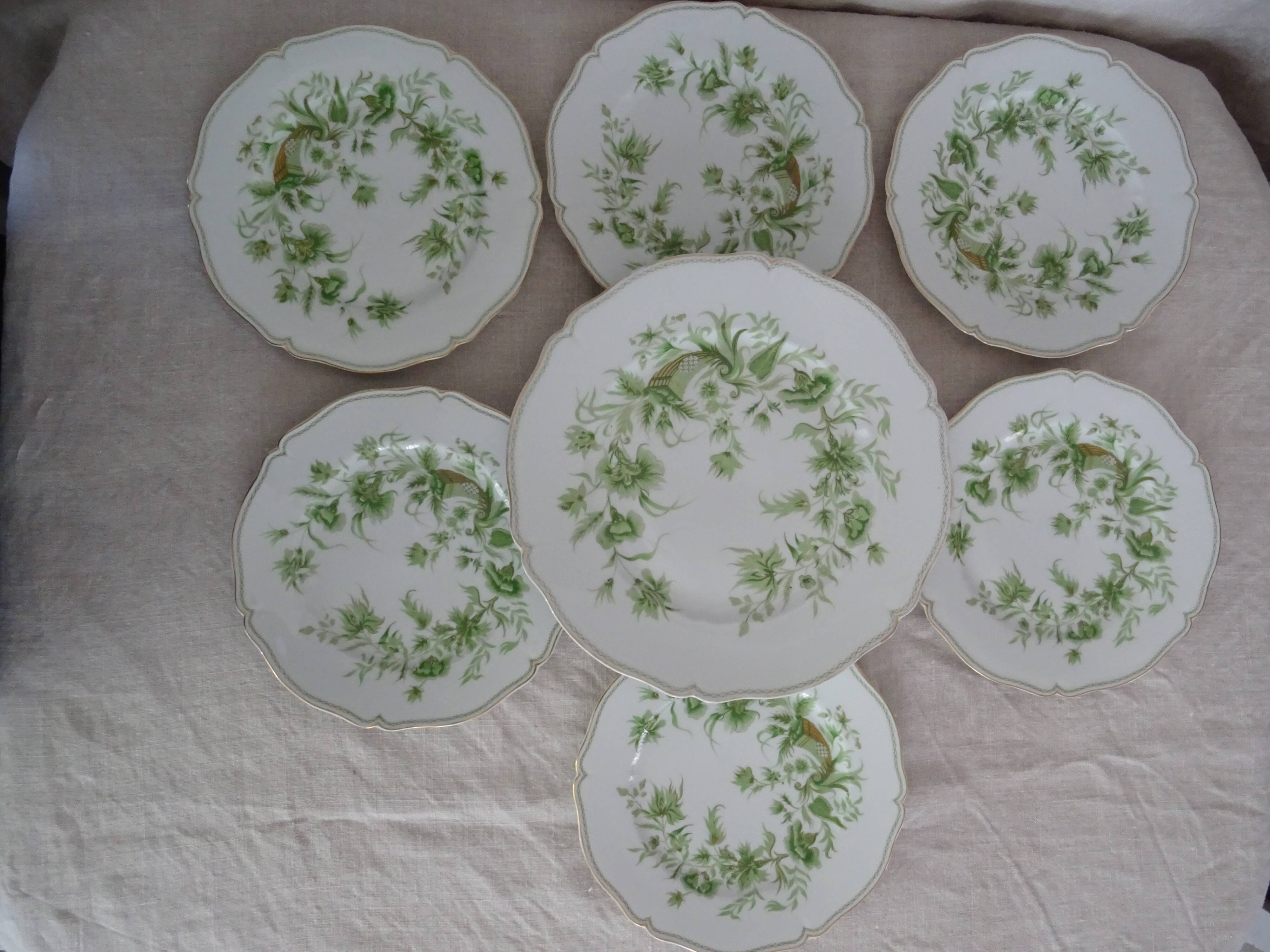 6 flat plates and 1 round dish haviland limoges with green and gold horn