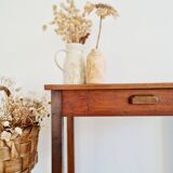 Old wooden table with its drawer