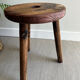 Three-legged wooden stool