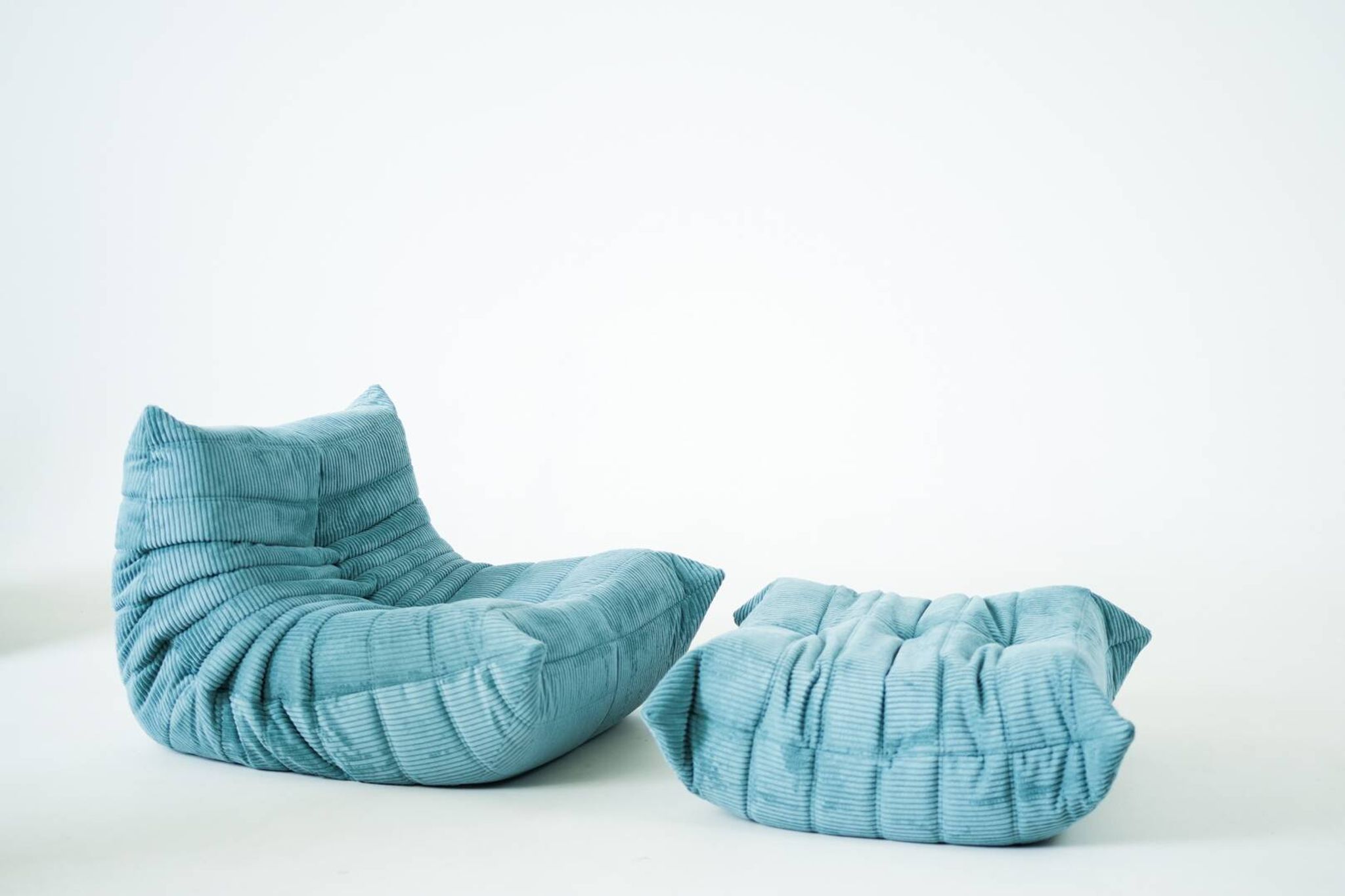 Togo set of armchair and pouf in light blue corduroy