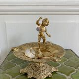 Brass cherub pocket-empty ashtray