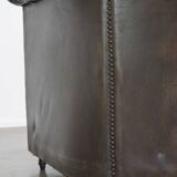 Old dark brown 3-seater cowhide chesterfield sofa with lots of character