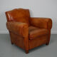 Vintage french moustache back cognac-colored leather club chair