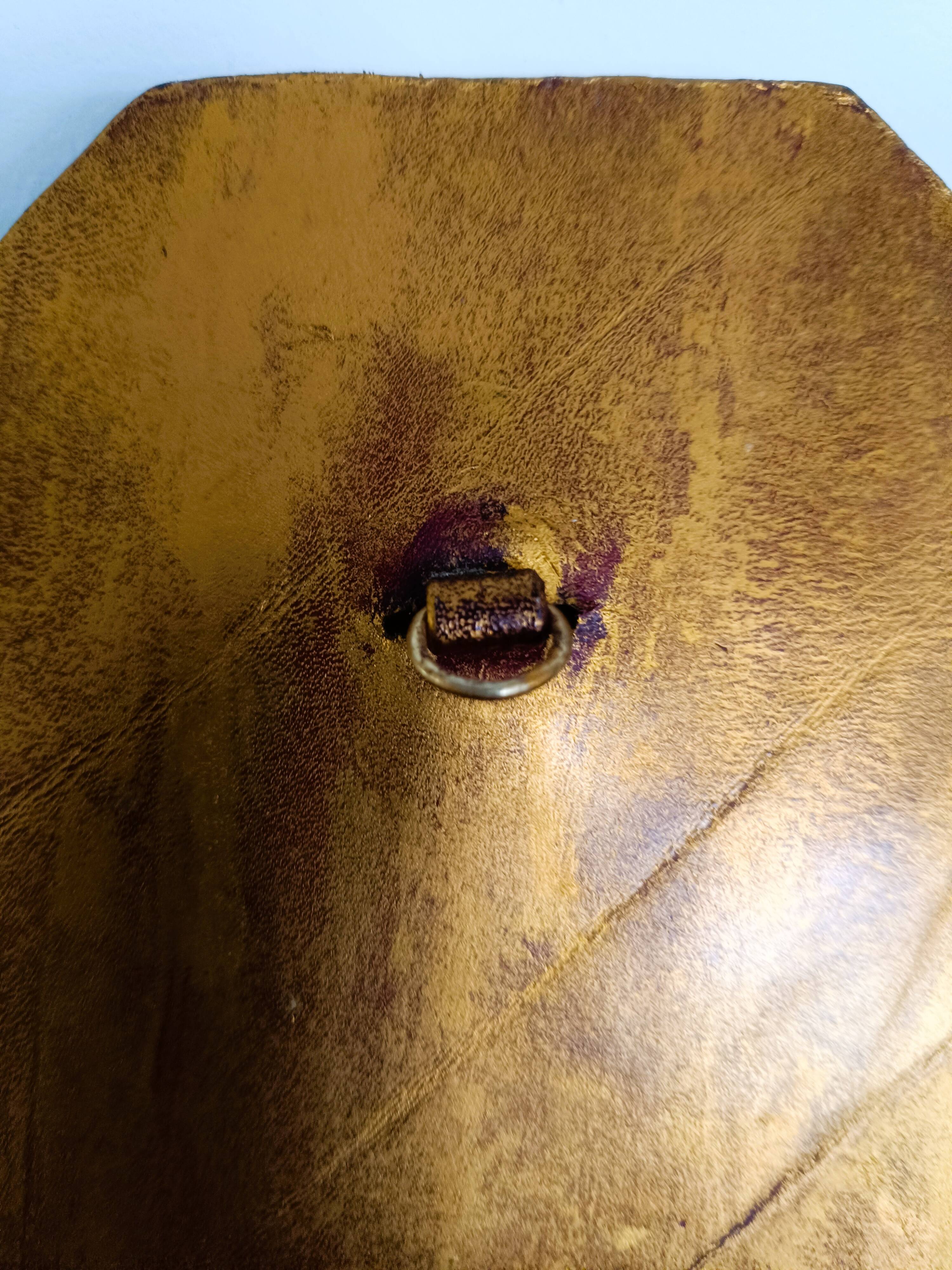 Small octagonal mirror in gold leather