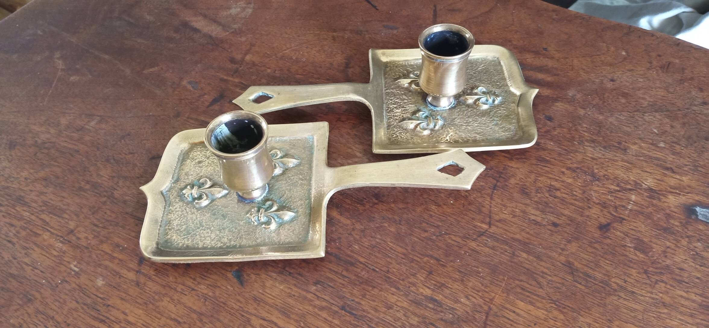 Pair of bronze candlesticks, fleur-de-lis