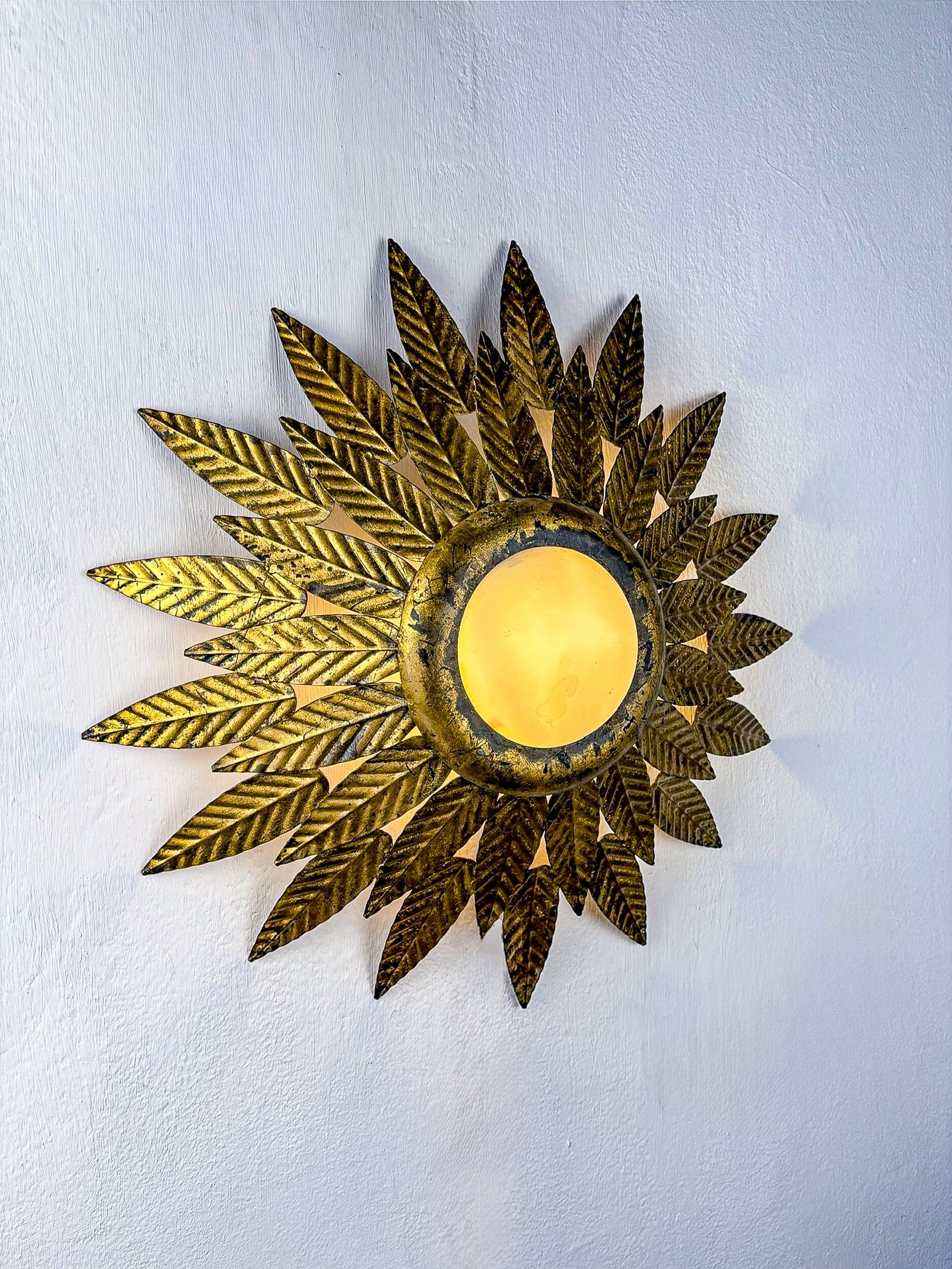Flower sunburst ceiling light fixture, gold leaf gilt iron & milk glass, Spain, 1950s
