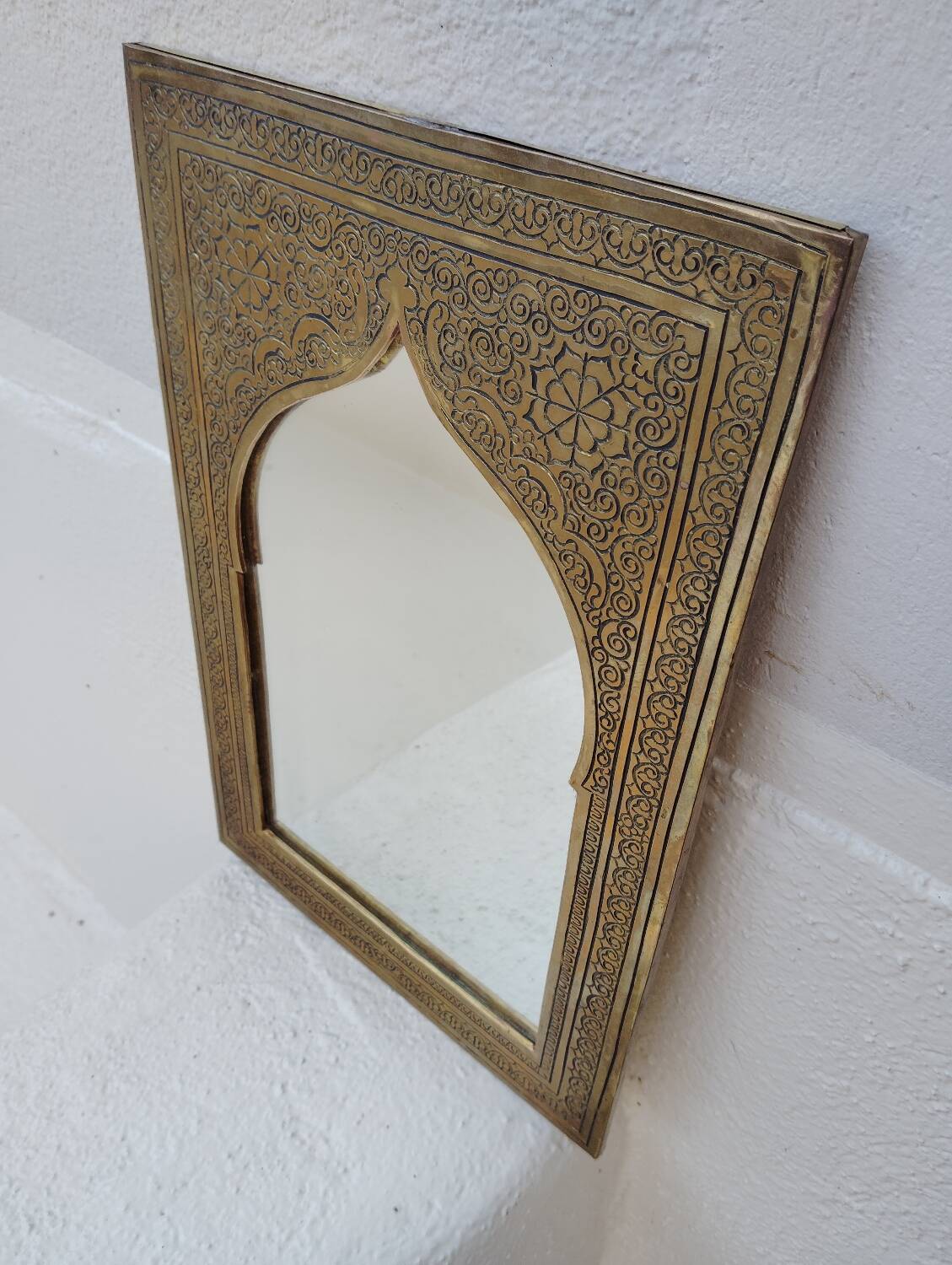 Golden oriental mirror