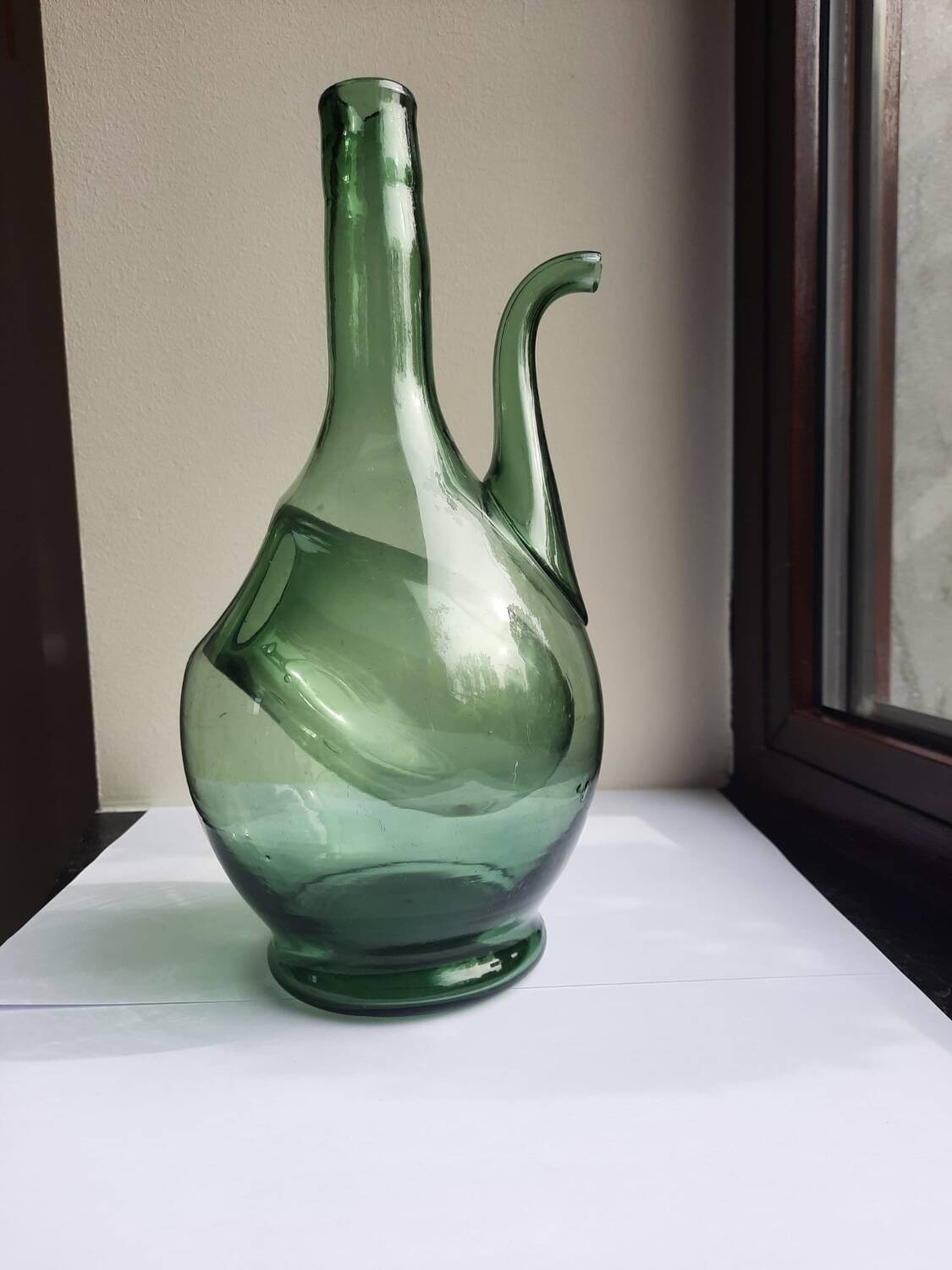 Pair of blown glass wine decanters in blue/green hues.