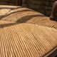 Antique Provençal armchair in wood with a straw seat.