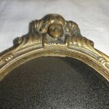 Old hand-facing mirror in gilded bronze