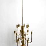 Three staged 18 arm Mid Century brass chandelier with a long brass rod