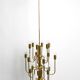 Three staged 18 arm Mid Century brass chandelier with a long brass rod