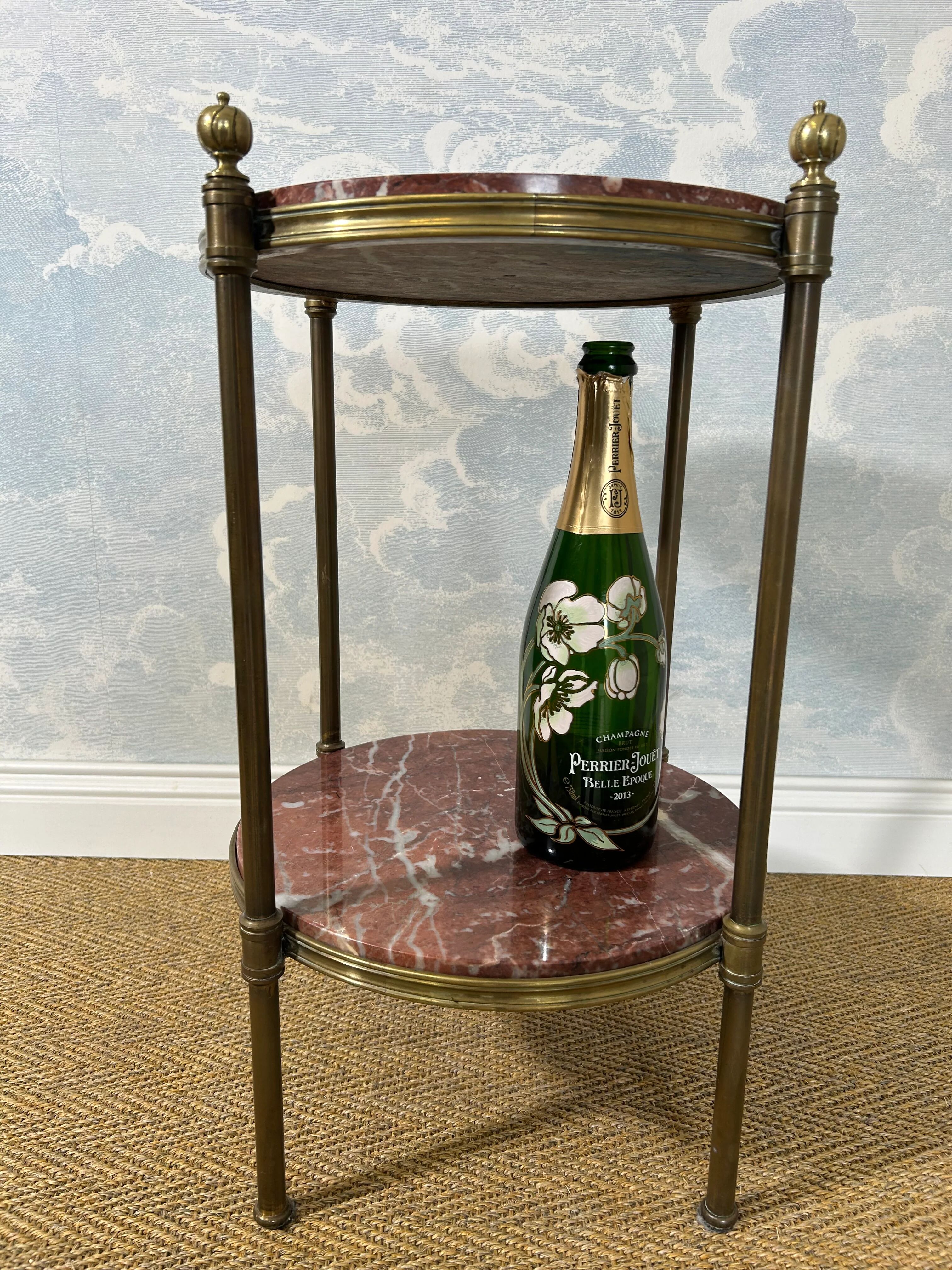 Two-tiered gueridon in Emperador marble on a brass structure, 1970s.