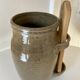 Old varnished stoneware pickle pot with tongs