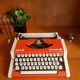 Portable typewriter " Olympia traveller de luxe " , red , in working order