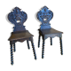 Duo of carved wooden chairs
