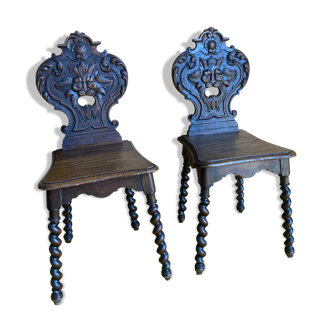 Duo of carved wooden chairs