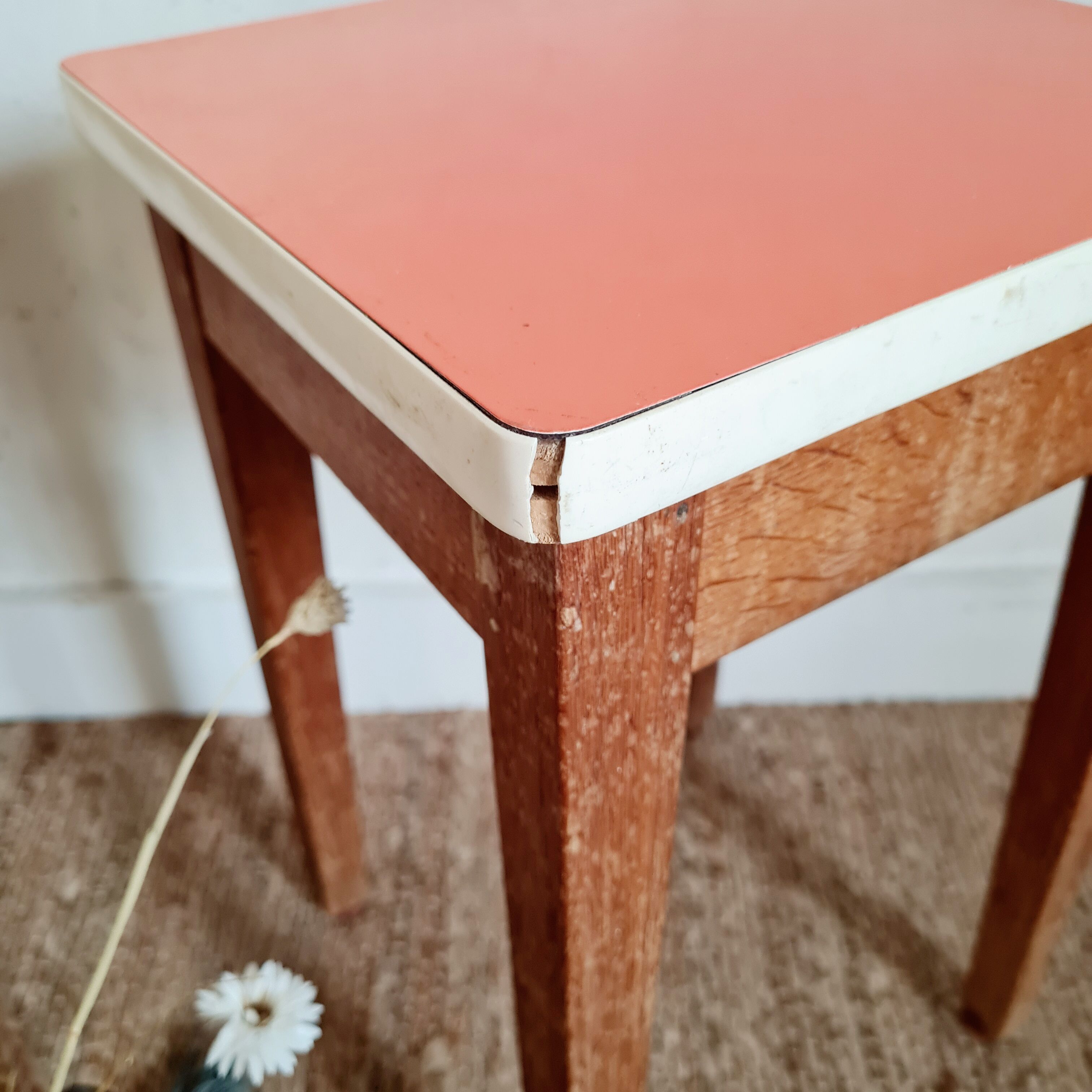 Wooden wax stool and orange formica
