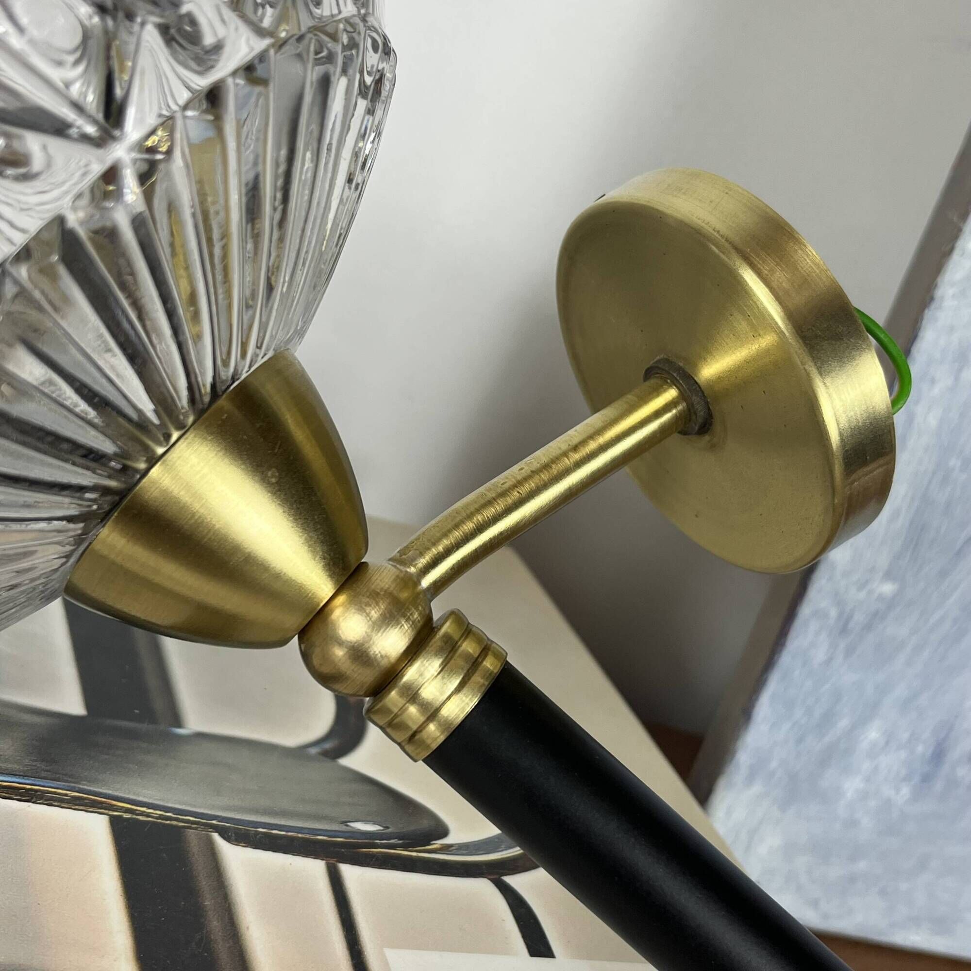 Vintage wall sconce torch in brass, thick glass globes.
