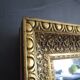 Large old mirror in wood and gilded stucco