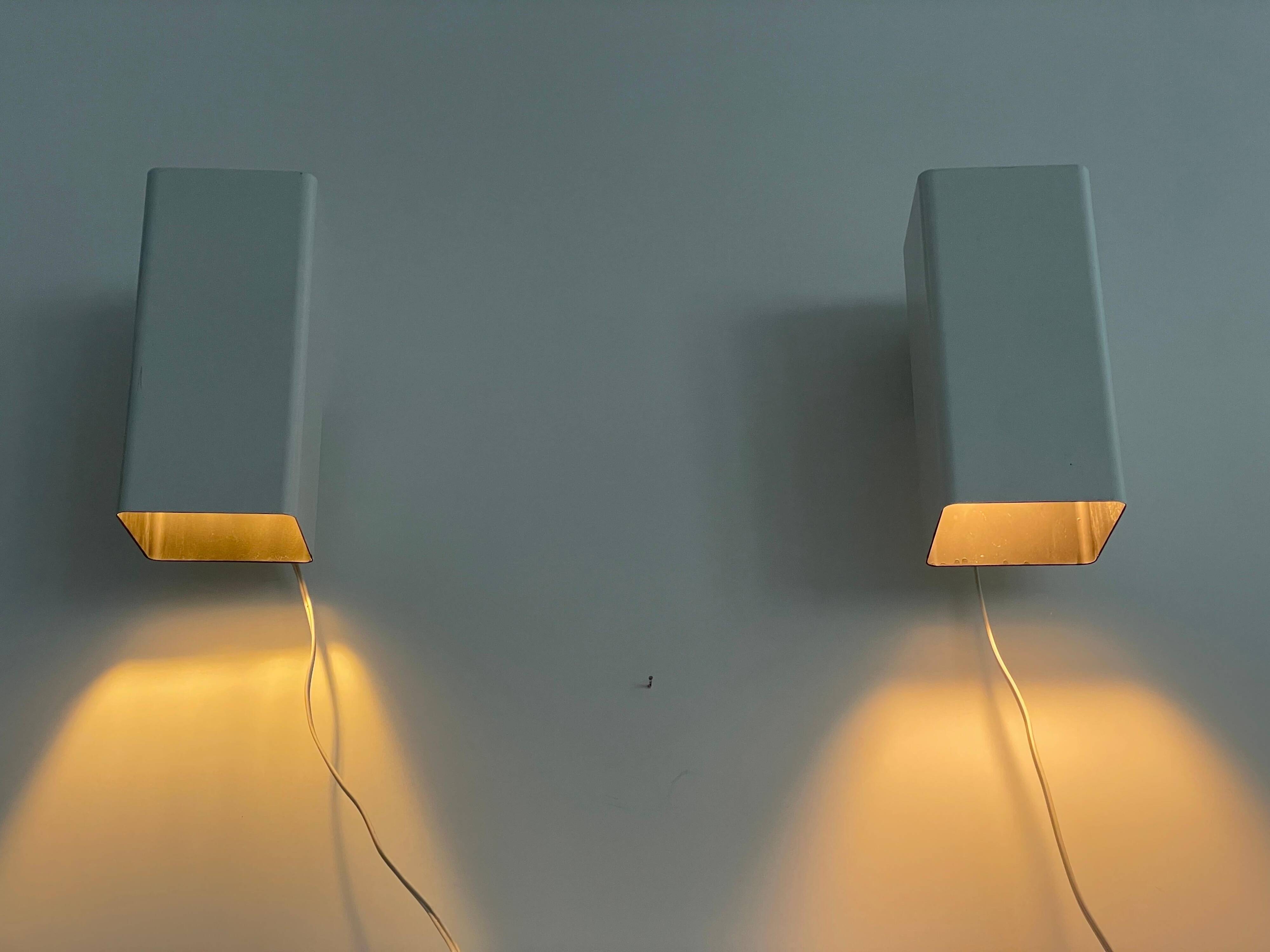 Pair of minimalist white metal wall lights from the mid-century, 1960, Germany.