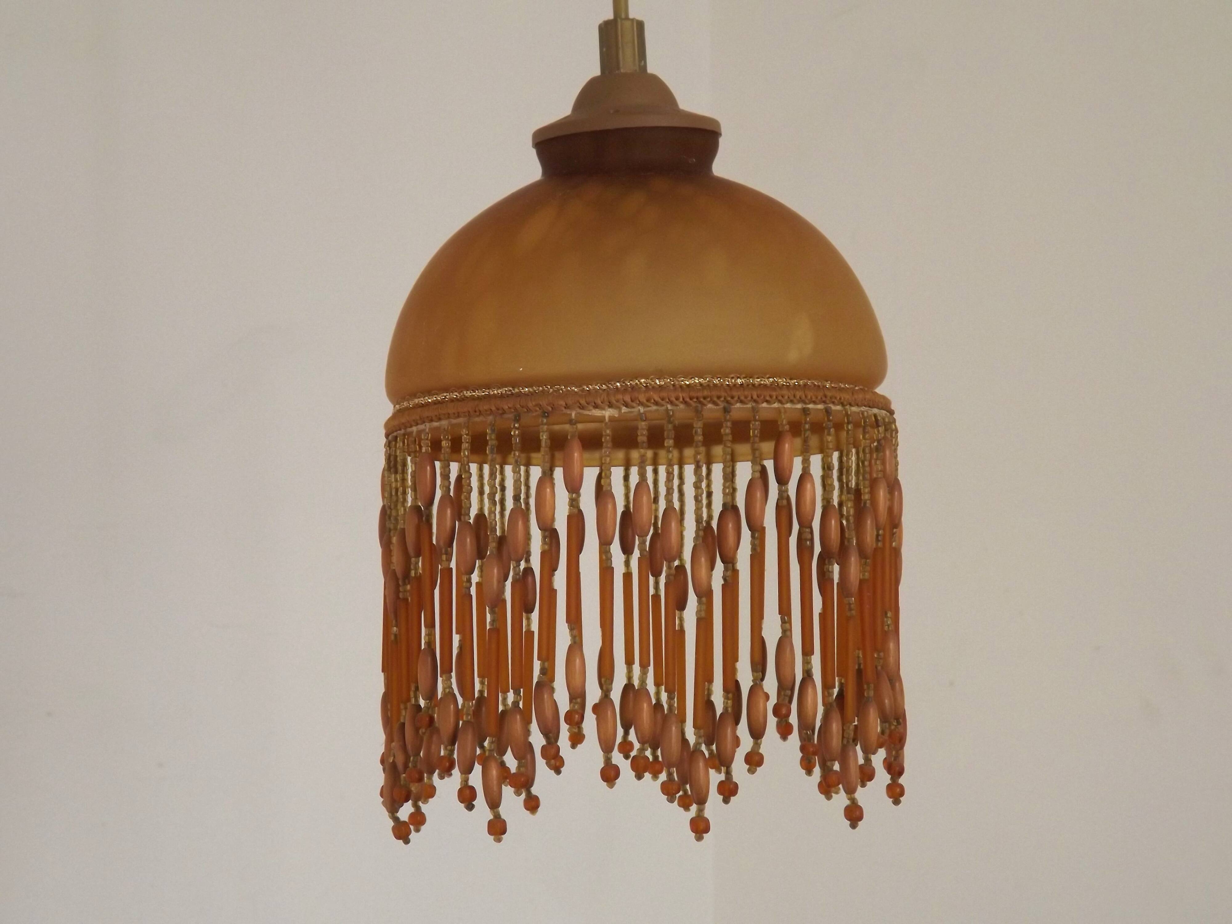 Vintage French amber mottled glass hanging ceiling light with beaded fringe.