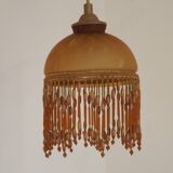 Vintage French amber mottled glass hanging ceiling light with beaded fringe.