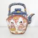 Japanese porcelain teapot with geisha decor