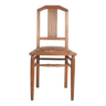 Art Deco style chair in carved wood and leather.