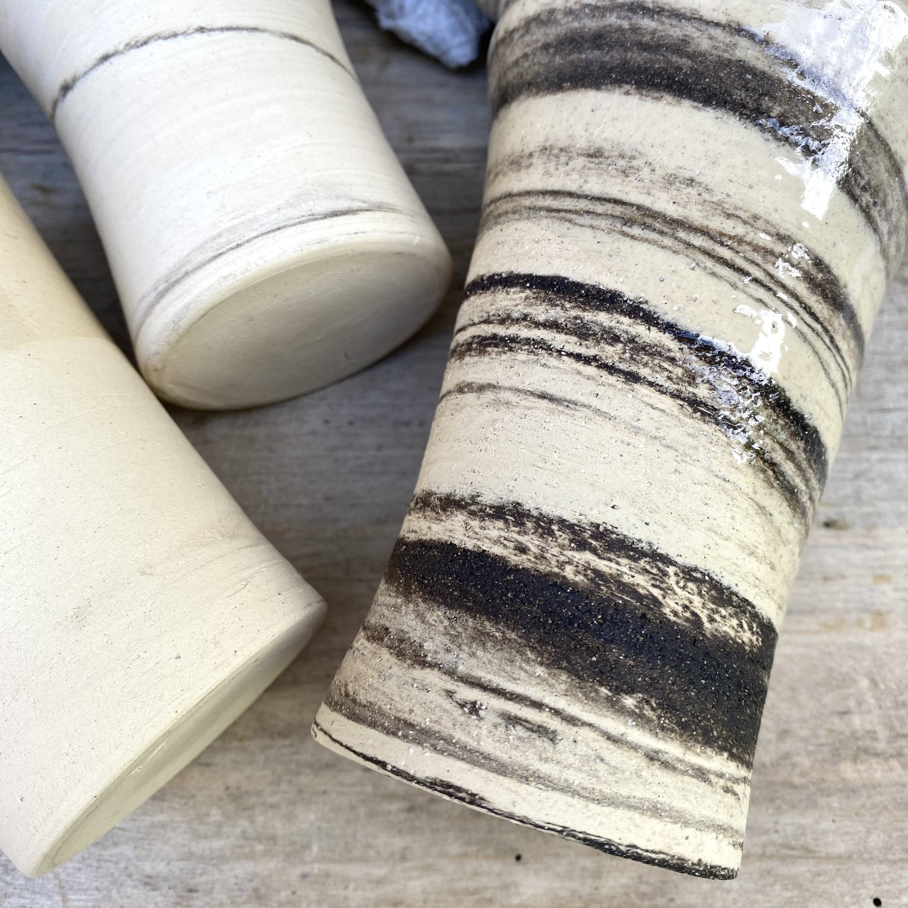 High ceramic cups made of mixed clay.