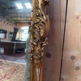 Napoleon III mirror in wood and gilded stucco with gold leaf.