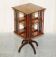 Sheraton-style rotating bookshelf side table in hardwood and satinwood.