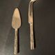 Golden metal cheese cutlery imitating bamboo
