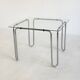 Italian vintage dining table with smooth glass and tubular frame base