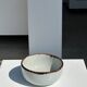 Small white glazed ceramic bowl black edges