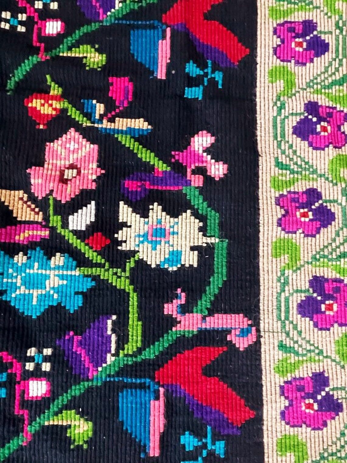 Romanian wool carpet floral design with green border on black background 180x153cm