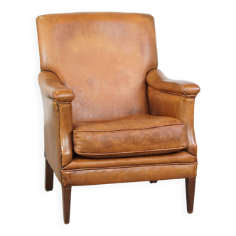 Fauteuil en cuir de mouton couleur cognac aux lignes droites
