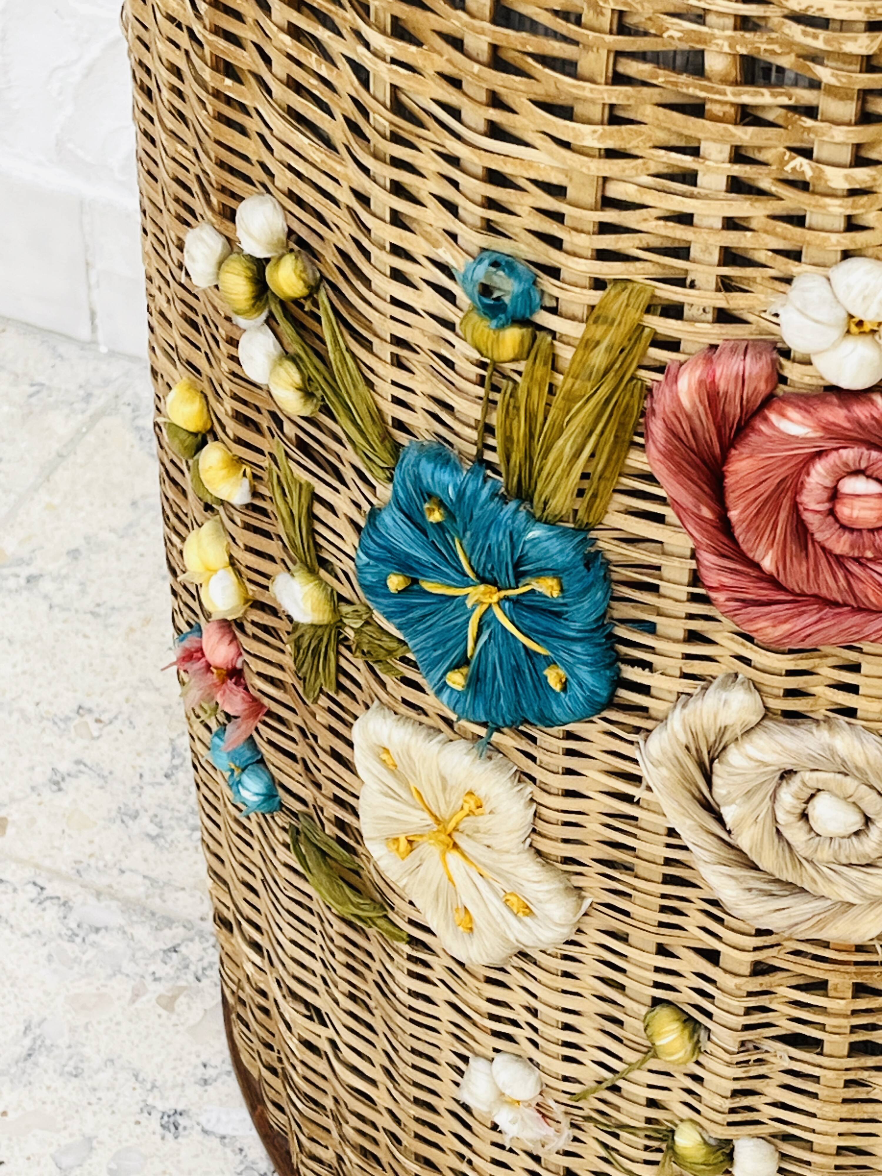 Vintage wicker mannequin with colourful floral decoration.