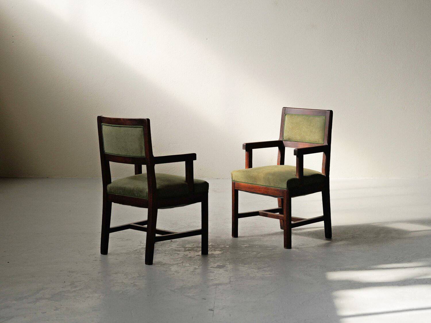 Pair of modernist armchairs in solid oak, France, circa 1940.