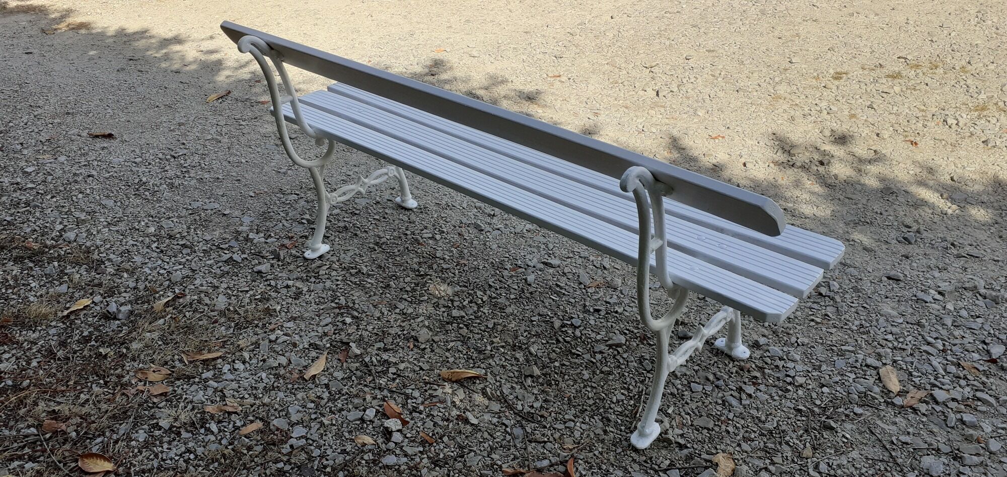 Old white garden bench cast iron feet 19th century