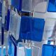 1970s designer table lamp with blue and clear plexiglass pendants.