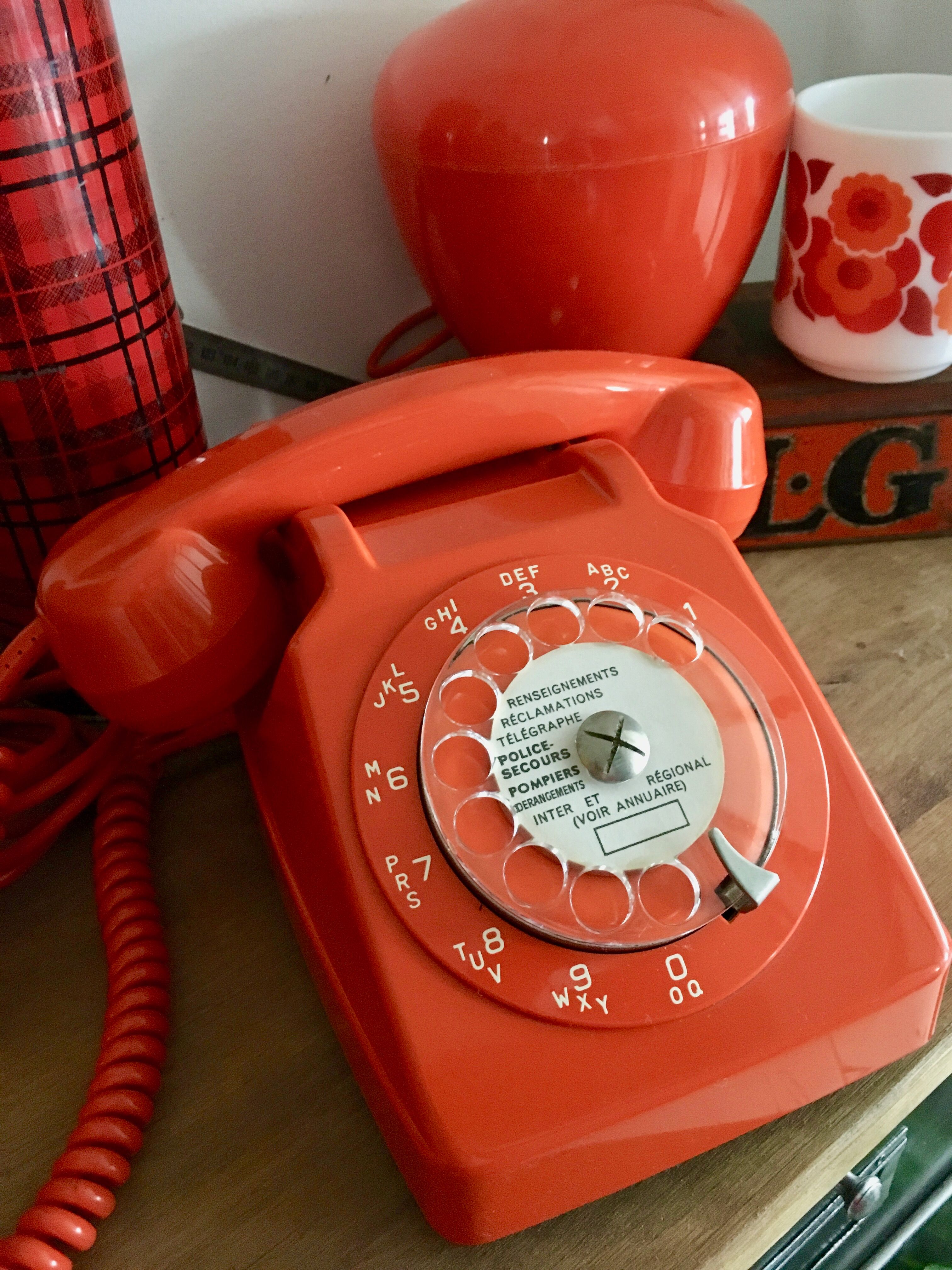 Orange vintage dial phone