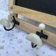 Wall-mounted coat rack with porcelain hooks