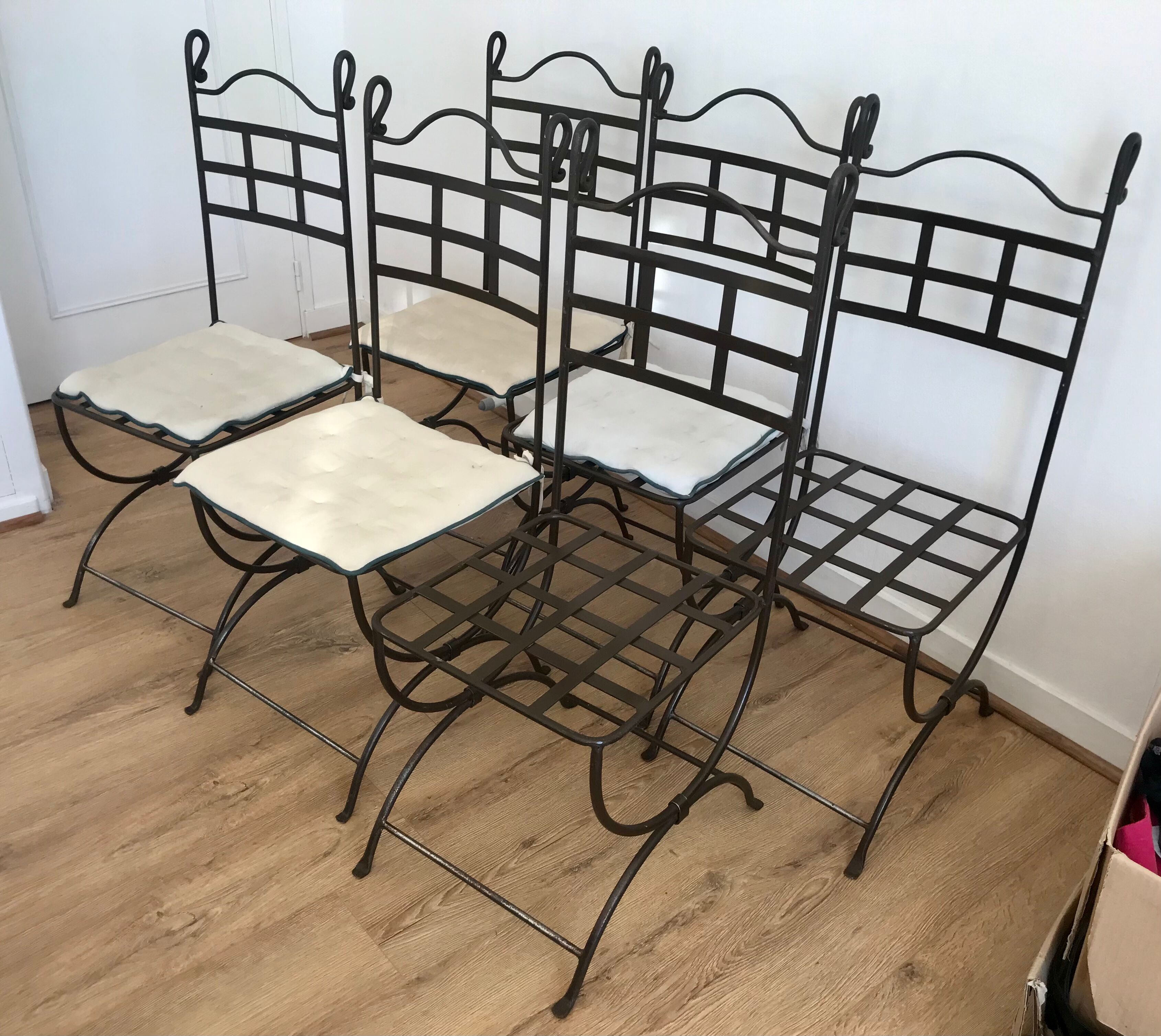 Six wrought iron chairs