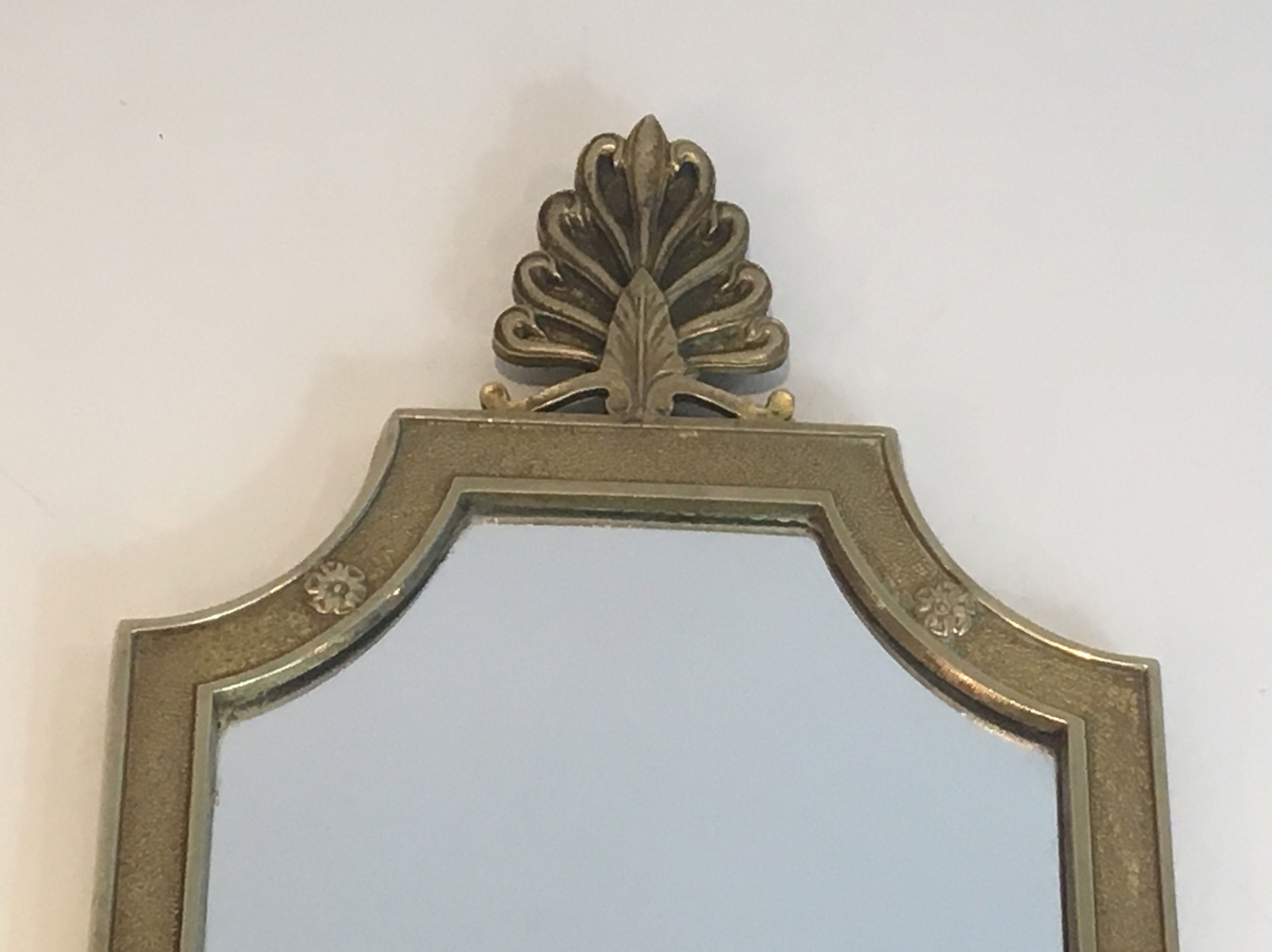 Pair of mirror and bronze wall lamps with lions' heads, french work. around 1940