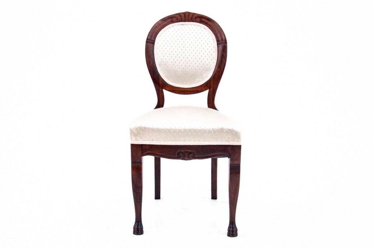 Late 19th century lion's paw table with chairs, Northern Europe.