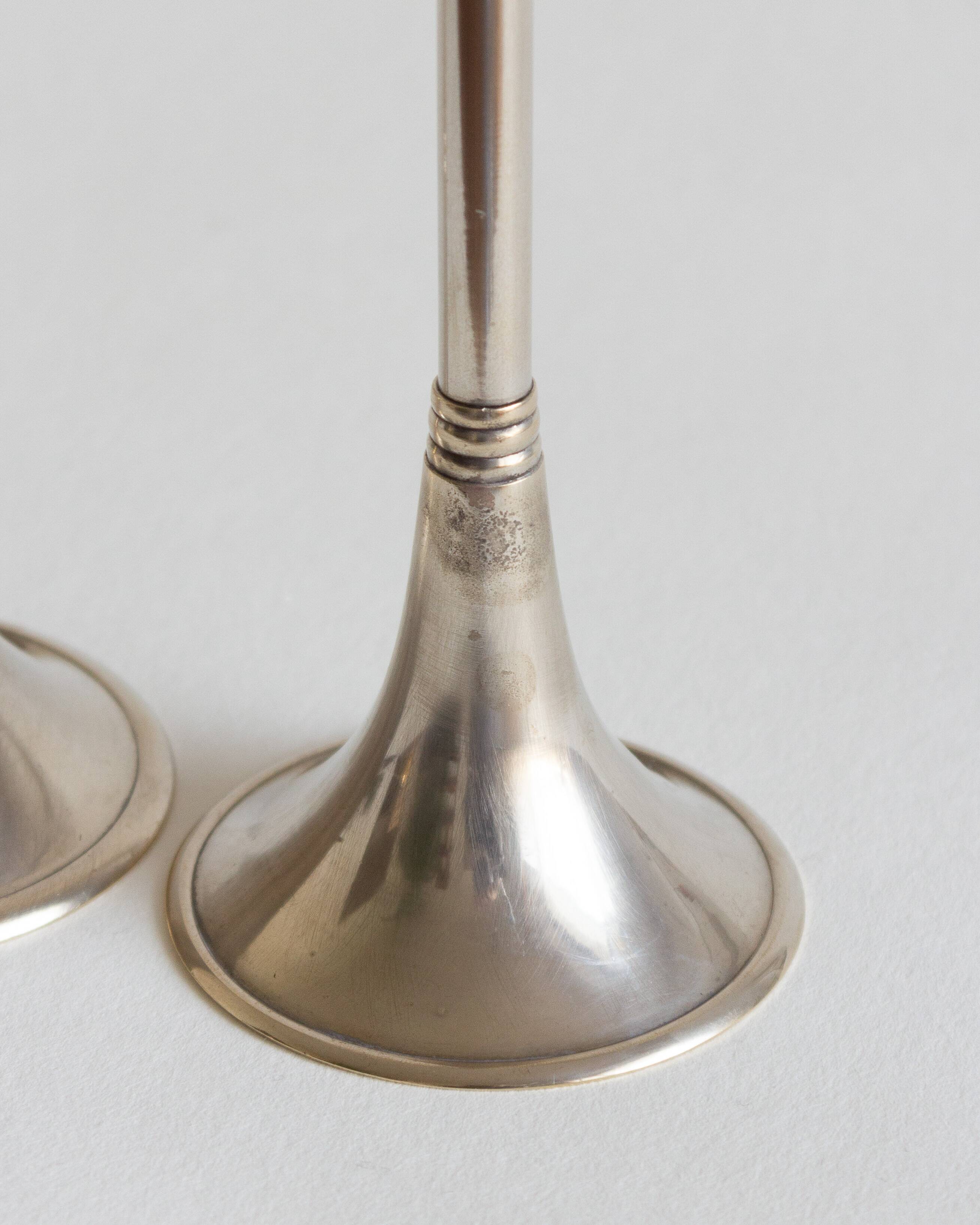Duo of silver-plated brass candlesticks, 1950s/1960s
